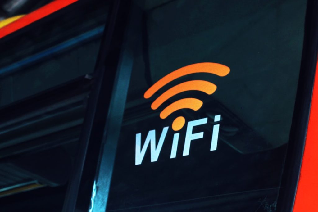 a-close-up-of-the-wifi-logo-on-the-side-of-a-bus-sodvyqqo4uu